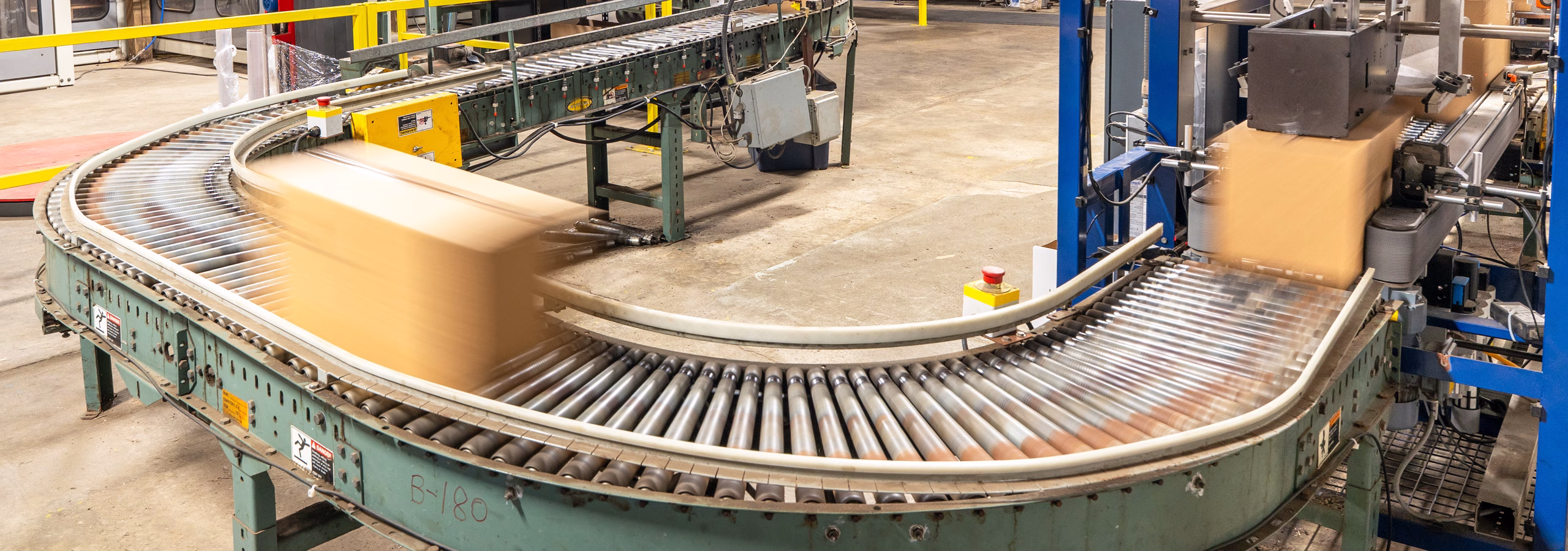 Automated end-of-line packaging and palletizing system at Custom Bottling & Packaging