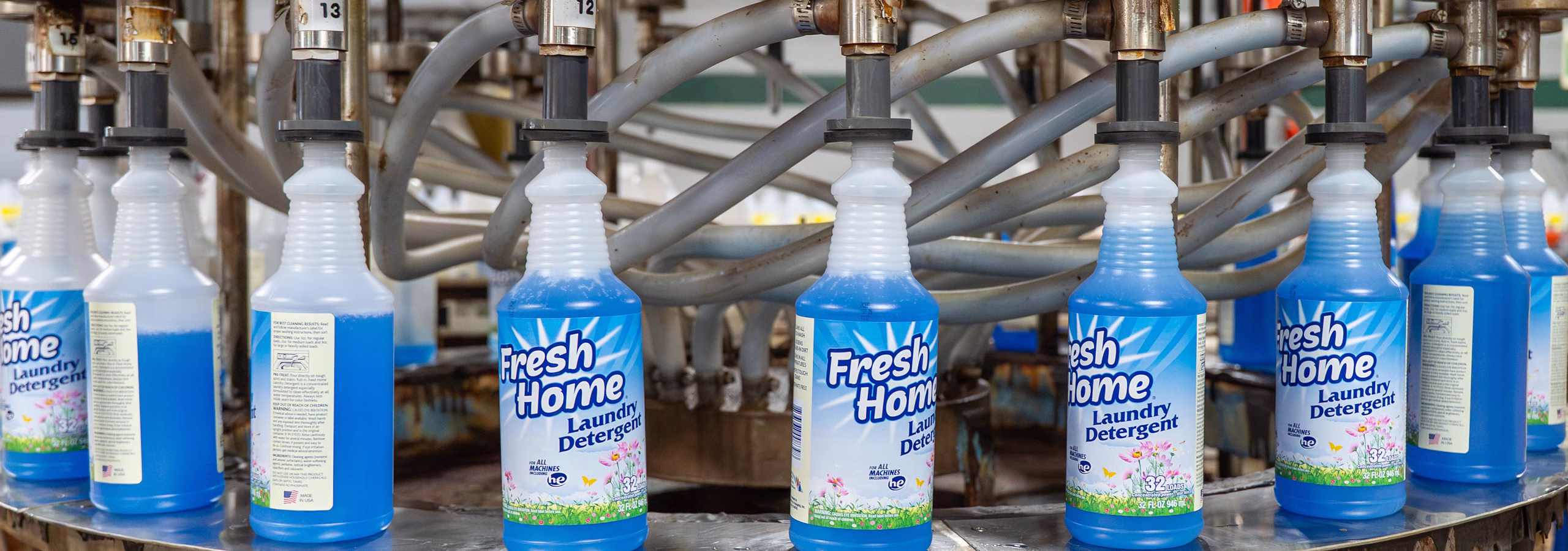 Filling bottles with cleaning solution at Custom Bottling & Packaging.